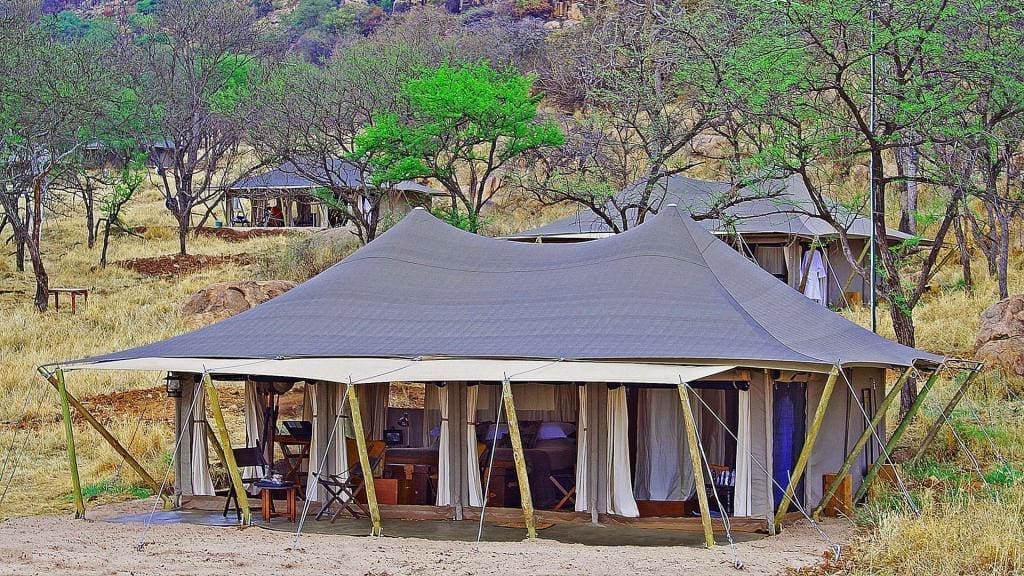 10 Best African Luxury Safari Camps For Conservation Safaris 13 serengeti pioneer camp tent camp view banner image